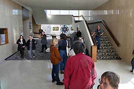 Ben's line of book-buyers extends backward from his table, with Karl Mischler standing on steps above Ben