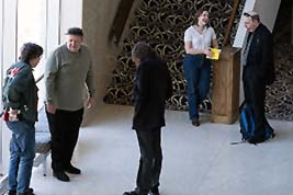 Attendees chat in the White Concert Hall lobby