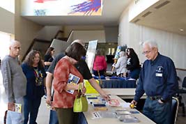 Attendees shopping in the lobby during a break in our White Concert Hall program