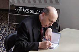 Front row view of Ben Model as he signs copies of his book in the lobby on Saturday afternoon