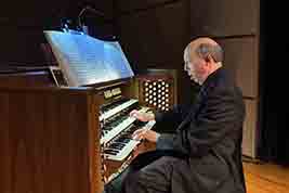 Ben Model played introductory music on the onstage concert hall organ